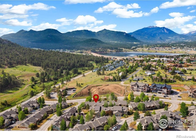 bird's eye view with a residential view and a water and mountain view