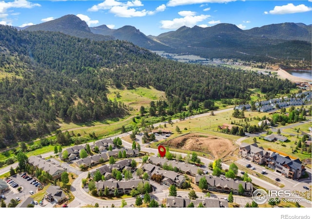 birds eye view of property with a residential view and a water and mountain view