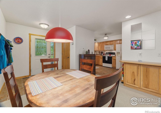 dining space with recessed lighting