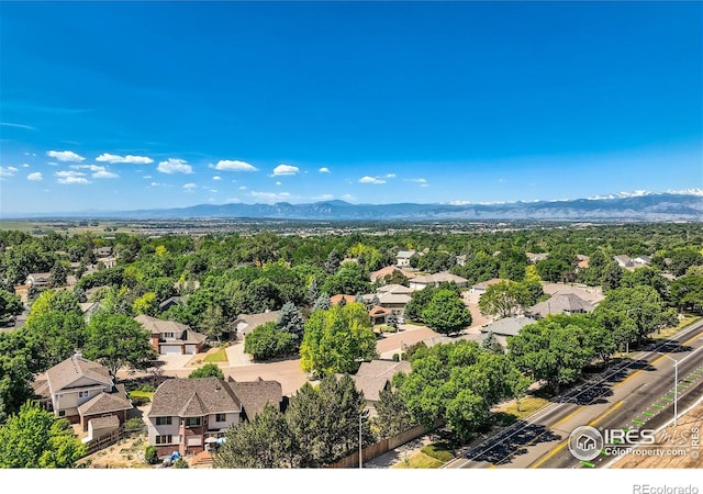 birds eye view of property with a mountain view