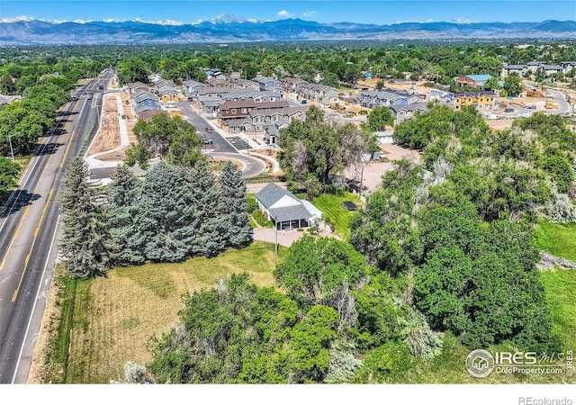 birds eye view of property with a mountain view