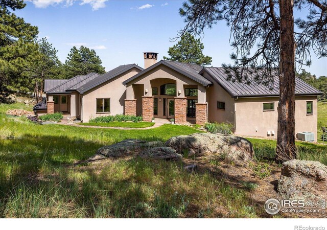 view of front of house featuring central AC unit