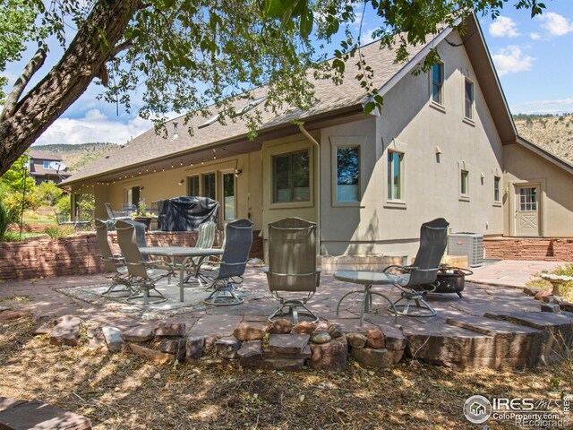 back of property with a patio