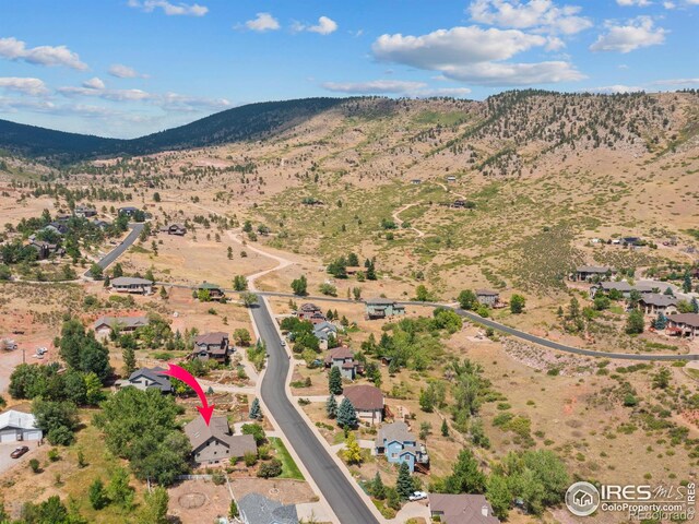 drone / aerial view featuring a mountain view