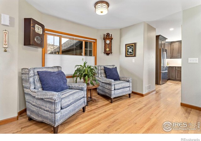 living area with light hardwood / wood-style floors