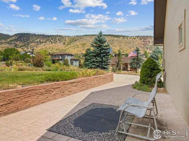 view of patio with a mountain view