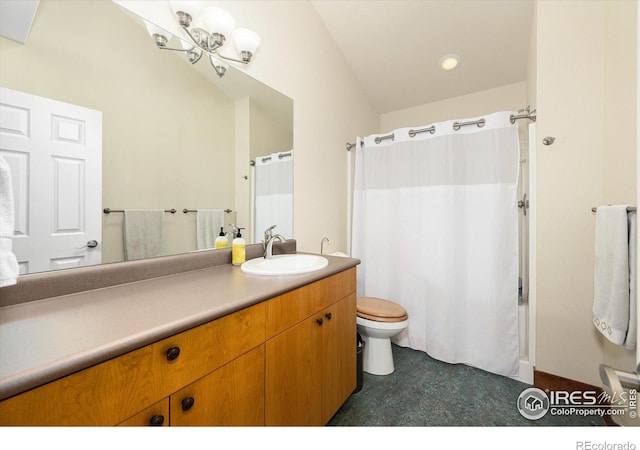 bathroom with walk in shower, vanity, and toilet