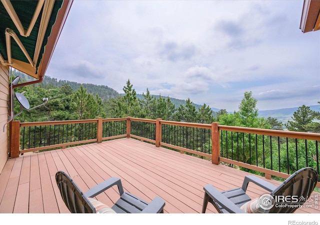 wooden terrace featuring a mountain view