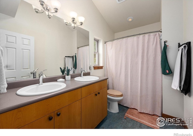 bathroom featuring vanity, lofted ceiling, a chandelier, and toilet