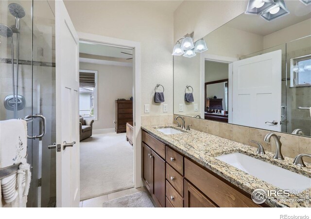 bathroom with vanity and an enclosed shower