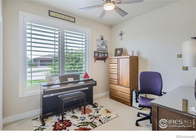 office area featuring ceiling fan and light colored carpet