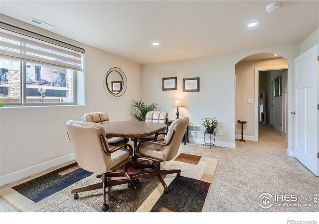 dining room featuring carpet