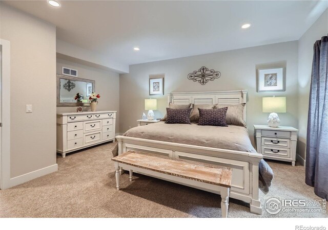 bedroom with light colored carpet