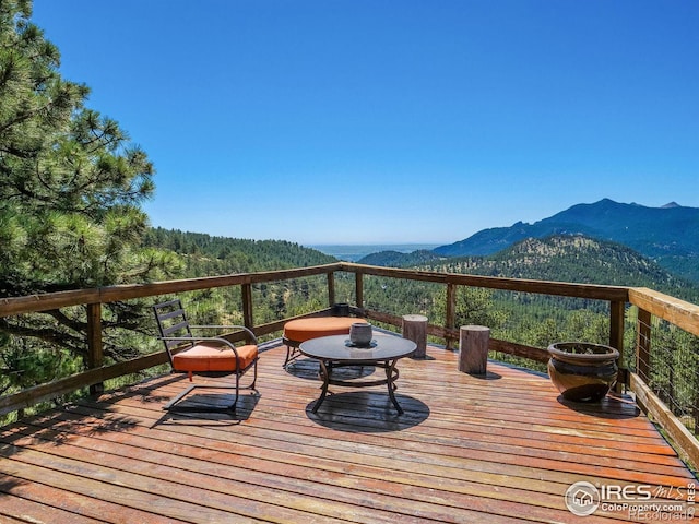 wooden deck featuring a mountain view