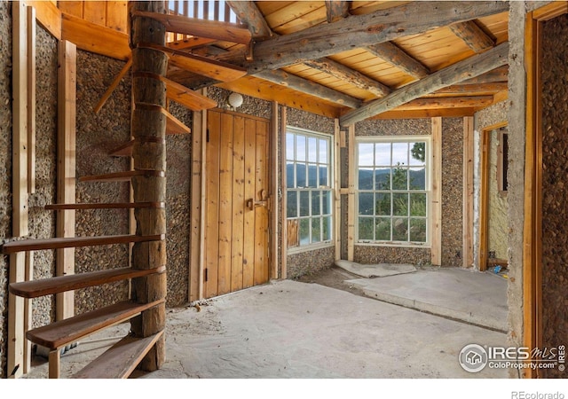 interior space with beam ceiling and wood ceiling