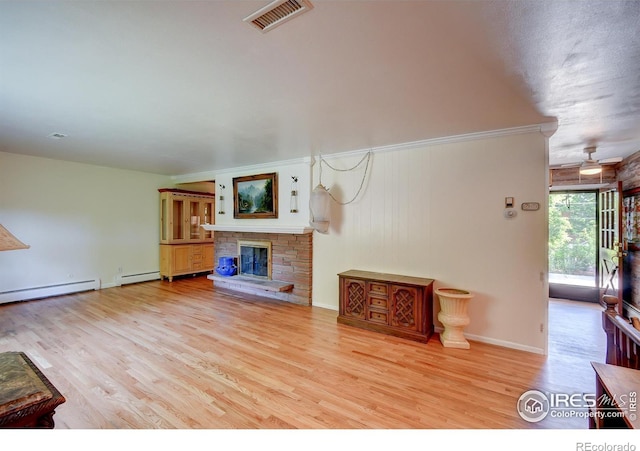 unfurnished living room with ceiling fan, a stone fireplace, light wood-type flooring, and baseboard heating