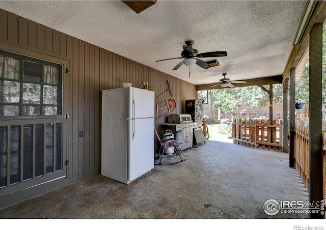 view of patio featuring ceiling fan