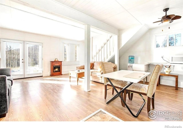 dining space with french doors, light hardwood / wood-style floors, wood ceiling, and ceiling fan