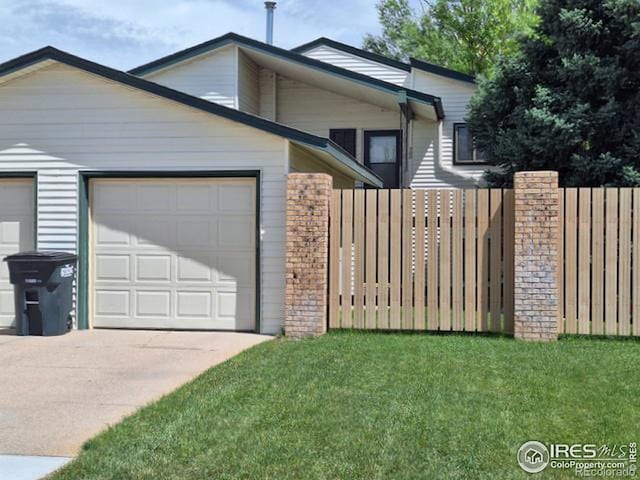 view of home's exterior featuring a yard and a garage