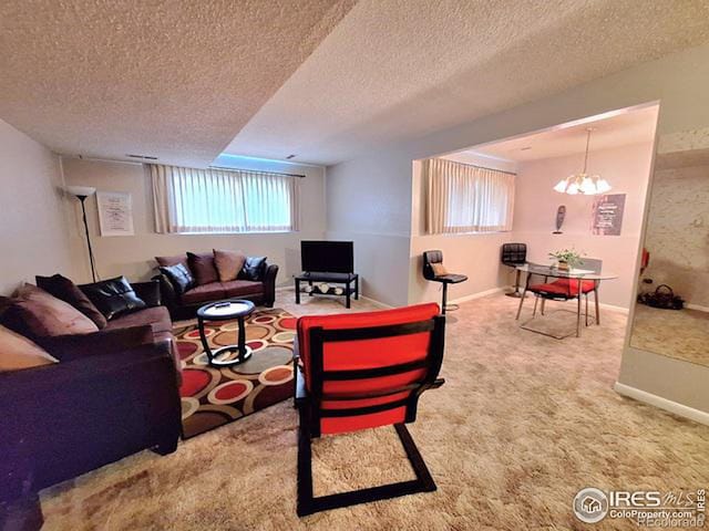 carpeted living room with a textured ceiling and an inviting chandelier