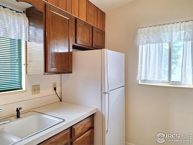 kitchen with white fridge and sink