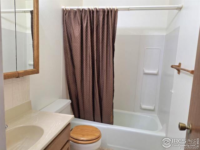 full bathroom with vanity, shower / bath combination with curtain, and toilet