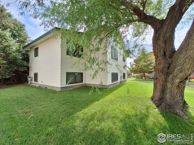 view of property exterior featuring a yard