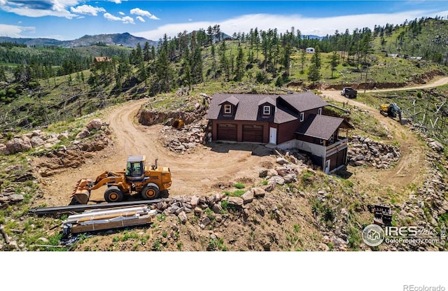 drone / aerial view featuring a mountain view