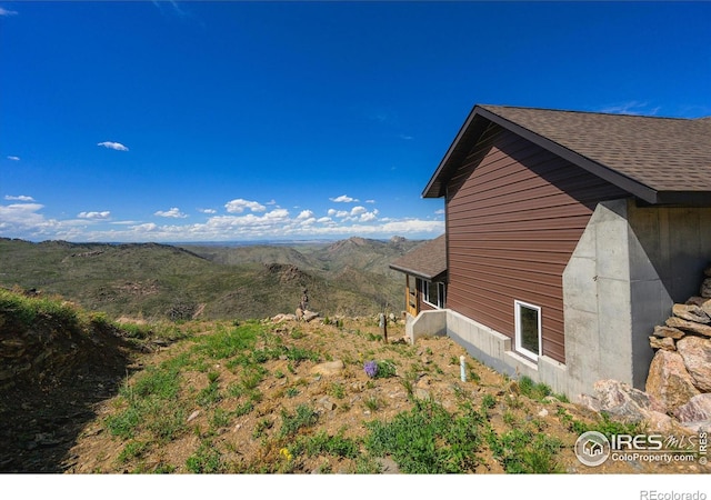 view of side of home featuring a mountain view