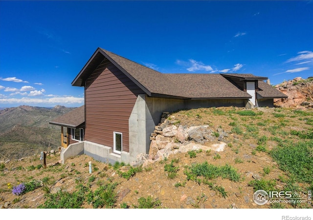 view of side of property featuring a mountain view