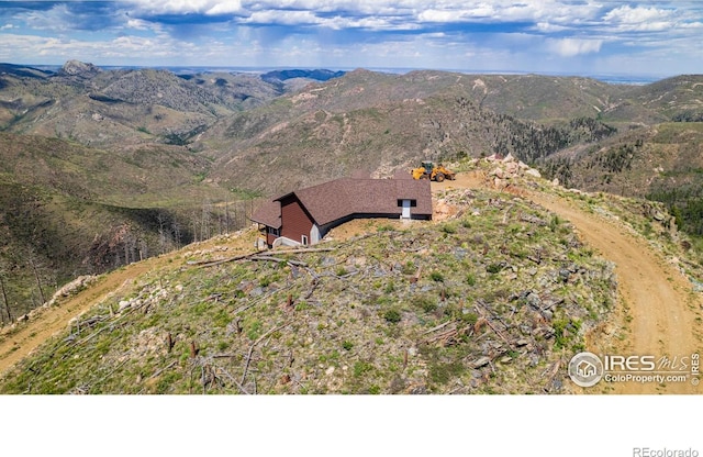 drone / aerial view featuring a mountain view