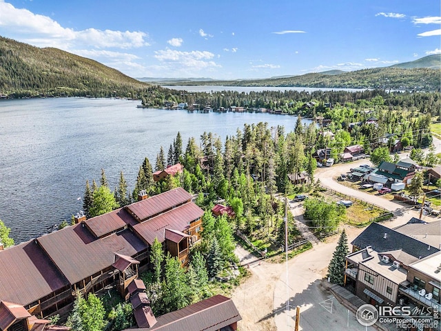 bird's eye view with a water and mountain view