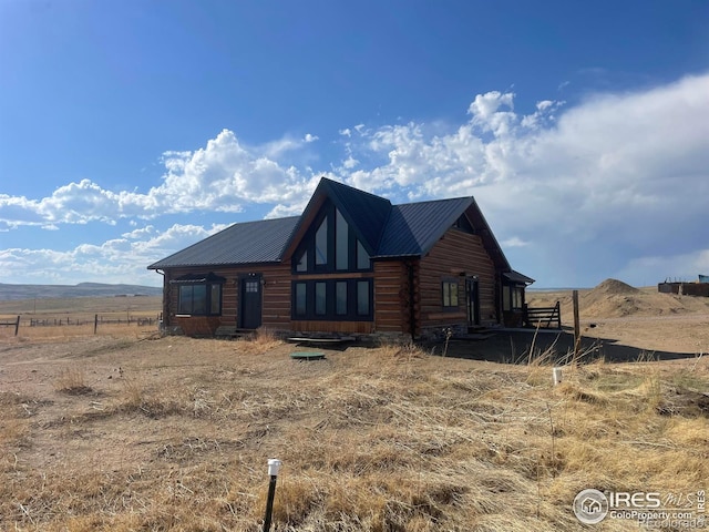 log-style house featuring a rural view