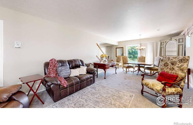 carpeted living room featuring an inviting chandelier