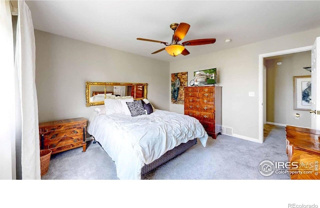 carpeted bedroom featuring ceiling fan