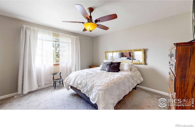 bedroom with light carpet and ceiling fan