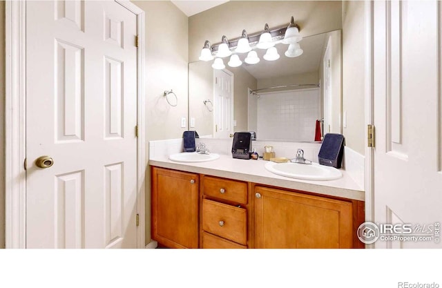 bathroom with vanity and walk in shower