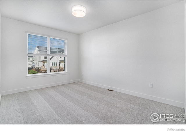 unfurnished room featuring carpet flooring