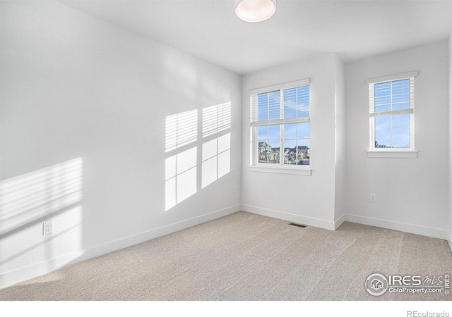 empty room with carpet floors