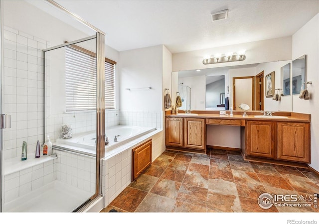 bathroom with separate shower and tub and vanity