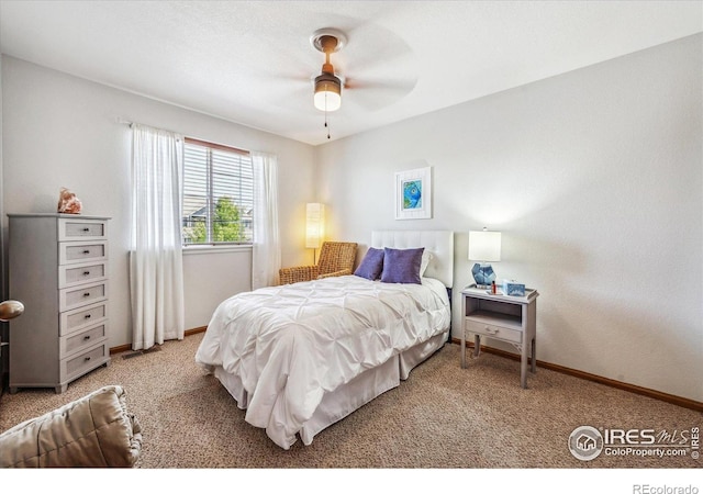 bedroom with ceiling fan and carpet floors