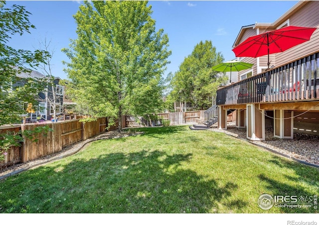 view of yard featuring a wooden deck