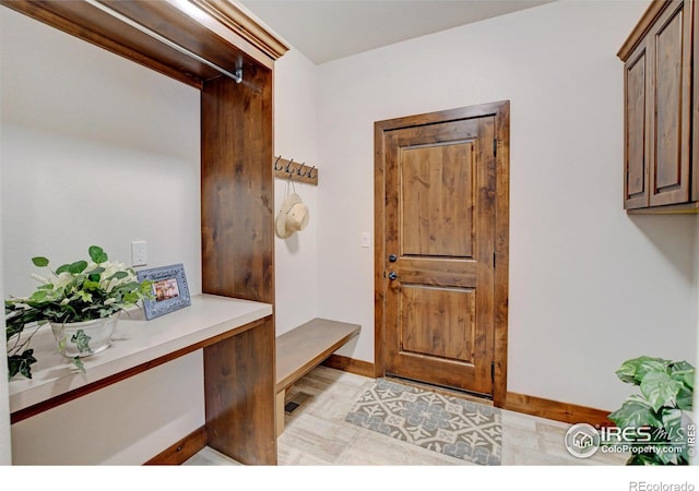 mudroom featuring baseboards