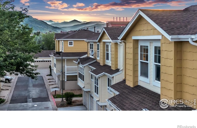 exterior space featuring a garage and a mountain view