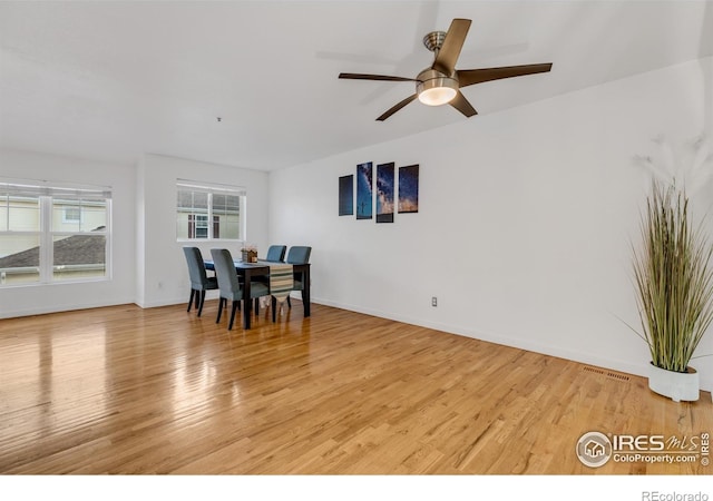 dining room featuring ceiling fan and light hardwood / wood-style flooring