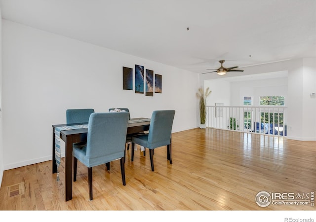 dining room featuring ceiling fan and light hardwood / wood-style flooring