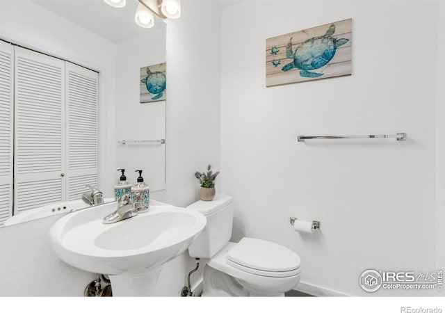 bathroom featuring sink and toilet