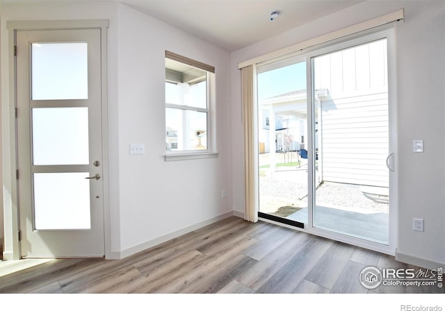 entryway with light hardwood / wood-style flooring