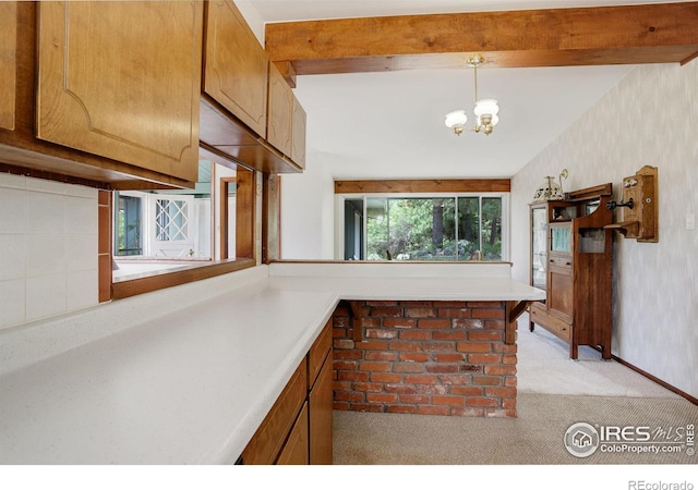 kitchen featuring vaulted ceiling with beams, light colored carpet, an inviting chandelier, and pendant lighting