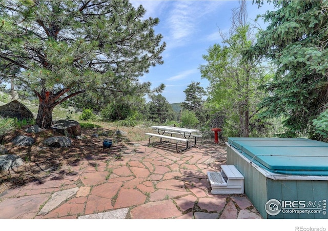 view of patio with a hot tub